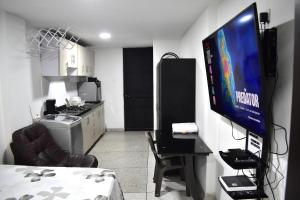 TV a/nebo společenská místnost v ubytování San Luis Apartamento 101 Cúcuta