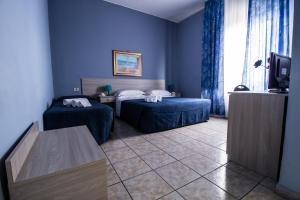 Postel nebo postele na pokoji v ubytování Miramare Hotel