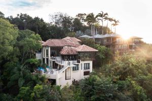 an aerial view of a house in the forest at Villa Aman - Tropical Luxury with Infinity Pool in Port Douglas