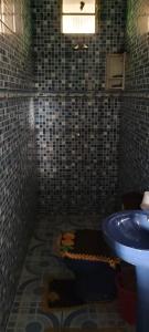a bathroom with a toilet and a sink at Casa Praia Cotijuba in Belém