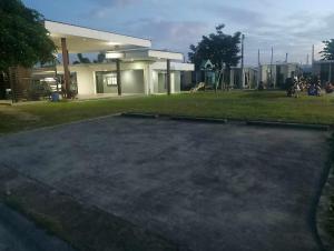 a large parking lot in front of a building at Lantern Villa in Calulut
