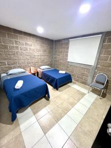 Ένα ή περισσότερα κρεβάτια σε δωμάτιο στο Habitación Rosedal 11