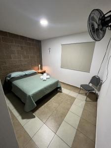 Ένα ή περισσότερα κρεβάτια σε δωμάτιο στο Habitación Rosedal 11