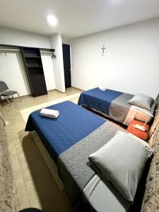 Ένα ή περισσότερα κρεβάτια σε δωμάτιο στο Habitación Rosedal 11