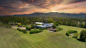 an aerial view of a house with a solar roof at Grapevines Boutique Accommodation in Pokolbin