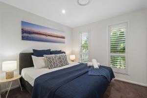 Ένα ή περισσότερα κρεβάτια σε δωμάτιο στο Seaclusion Broadbeach