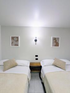Letto o letti in una camera di Hotel Bombay