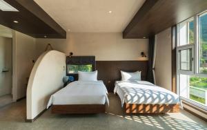 Yangshuo One Thousand and One Courtyard Views B&B客房内的一张或多张床位