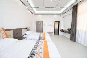 Meizhou Island Zhengxinju Homestay客房内的一张或多张床位