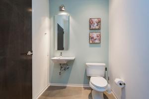 a bathroom with a toilet and a sink at 5M412- Sophisticated 1BR Condo in Nashville