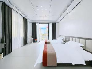 Meizhou Island Zhengxinju Homestay客房内的一张或多张床位