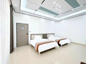 Meizhou Island Zhengxinju Homestay客房内的一张或多张床位