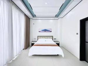 Meizhou Island Zhengxinju Homestay客房内的一张或多张床位