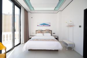 Meizhou Island Zhengxinju Homestay客房内的一张或多张床位