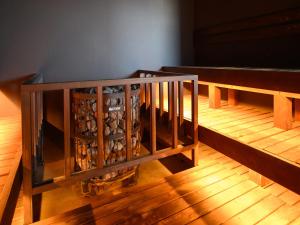 a wine rack with a bunch of wine bottles at hotel androoms Sapporo Susukino in Sapporo