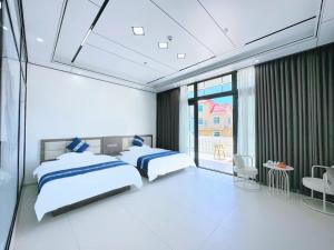 Meizhou Island Zhengxinju Homestay客房内的一张或多张床位