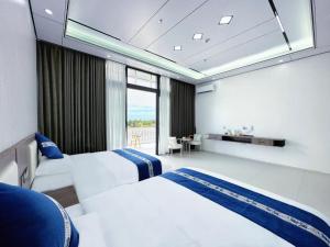 Meizhou Island Zhengxinju Homestay客房内的一张或多张床位