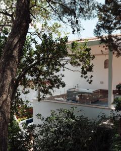 a building with a bus parked in front of it at Luxury Villa Civico 27 - Capri Centro in Capri +15 photos