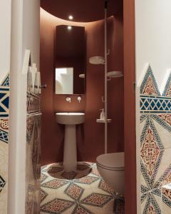 a bathroom with a toilet and a mirror at Luxury Villa Civico 27 - Capri Centro in Capri