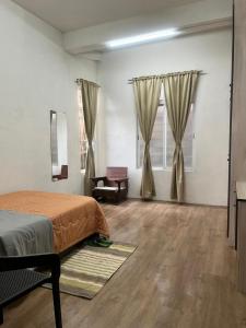 Ένα ή περισσότερα κρεβάτια σε δωμάτιο στο Chawng Homestay