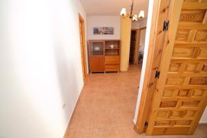 a hallway with a door leading to a room at Apartamento Zahara in Zahara de los Atunes