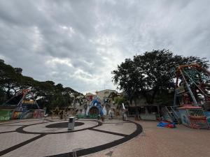 a large amusement park with a roller coaster at Agoo Tourist Cabin in Agoo