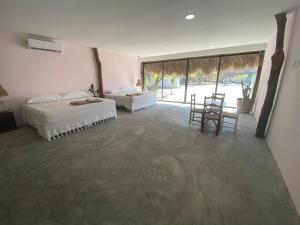 Postel nebo postele na pokoji v ubytování Cabañas y Restaurante La Luna + 20 fotografií