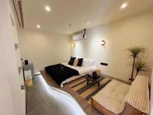 Кът за сядане в Yish Cinema Serviced Apartment B&B