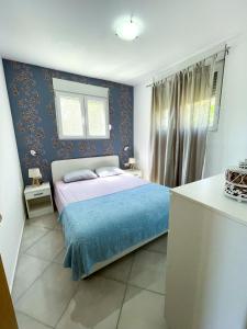 Postel nebo postele na pokoji v ubytování Al Mare Vacation Home