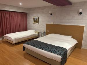 Postel nebo postele na pokoji v ubytování Town Hotel 41