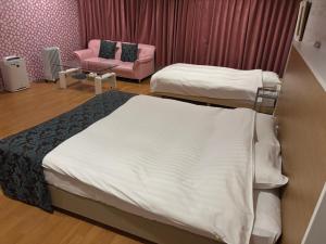 Postel nebo postele na pokoji v ubytování Town Hotel 41