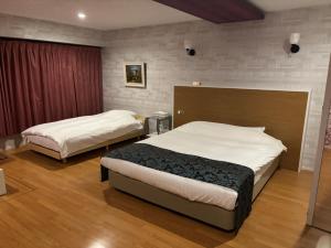 Postel nebo postele na pokoji v ubytování Town Hotel 41