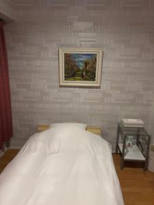 Postel nebo postele na pokoji v ubytování Town Hotel 41