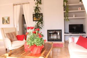 a living room with a coffee table and a fireplace at Altea Hills Villa Casablanca 23 in Altea