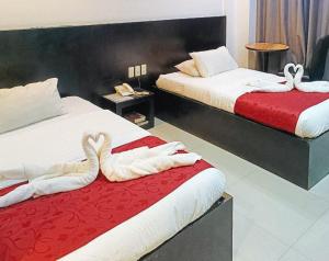Postel nebo postele na pokoji v ubytování Check Inn Hotel Dumaguete City by RedDoorz
