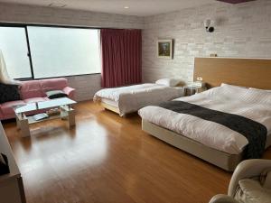 Postel nebo postele na pokoji v ubytování Town Hotel 41