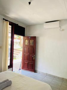 Perwita Homestay客房内的一张或多张床位
