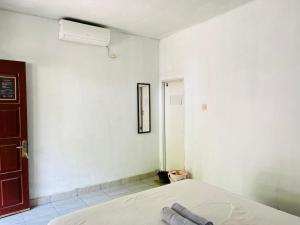 Perwita Homestay客房内的一张或多张床位