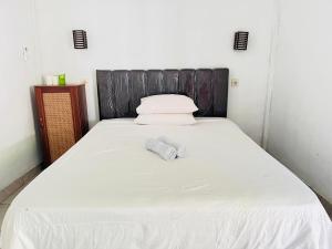 Perwita Homestay客房内的一张或多张床位