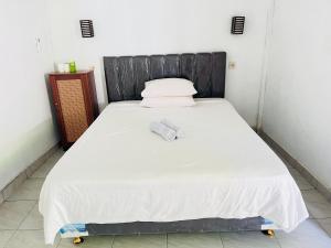 Perwita Homestay客房内的一张或多张床位