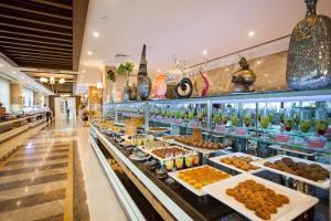 a buffet line with different types of food on display at Karmir Resort & Spa - Ultra All Inclusive in Kemer