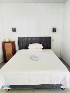 Perwita Homestay客房内的一张或多张床位