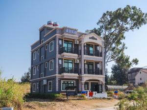 an apartment building on the side of the road at Maimai B&B, Ganluyuan in Tung-chou +42 photos