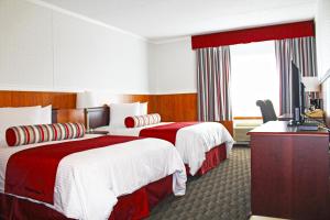 a hotel room with two beds and a television at Hotel North in North Sydney +23 photos