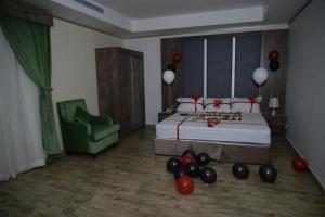 Postel nebo postele na pokoji v ubytování فندق سويت لافندر Lavender Suite Hotel