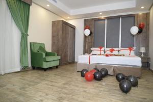 Postel nebo postele na pokoji v ubytování فندق سويت لافندر Lavender Suite Hotel