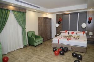 Postel nebo postele na pokoji v ubytování فندق سويت لافندر Lavender Suite Hotel
