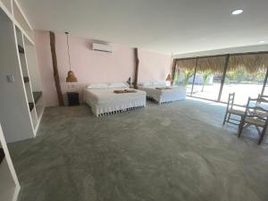 Postel nebo postele na pokoji v ubytování Cabañas y Restaurante La Luna