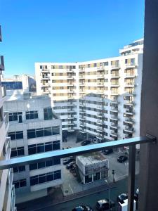 a view of a parking lot from a balcony of a building at Vitan Marvel in Bucharest +2 photos