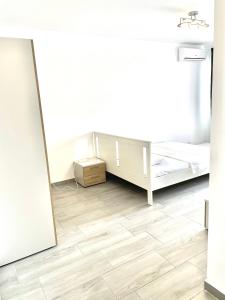 a room with a bed and a mirror at Vitan Marvel in Bucharest